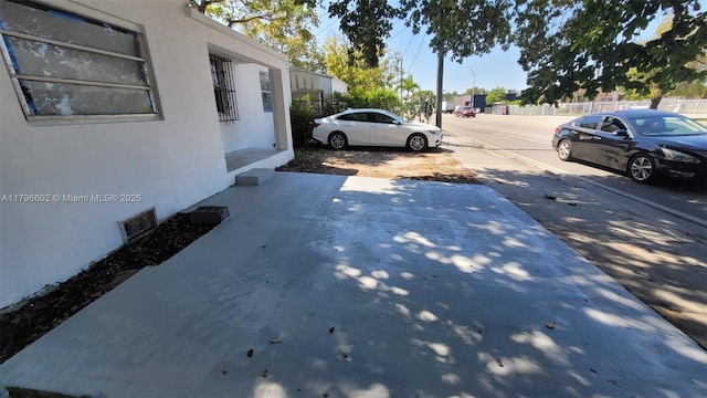 view of parking with visible vents