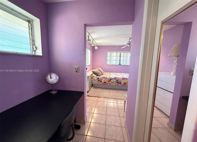 bathroom with rail lighting, a textured ceiling, a ceiling fan, and tile patterned floors