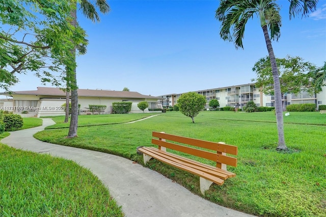view of home's community featuring a yard