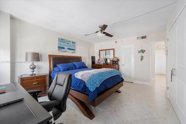 2100 S Ocean Dr Unit 10E, Fort Lauderdale, FL 33316 - bathroom featuring toilet, a shower stall, tile patterned flooring, vanity, and a wainscoted wall