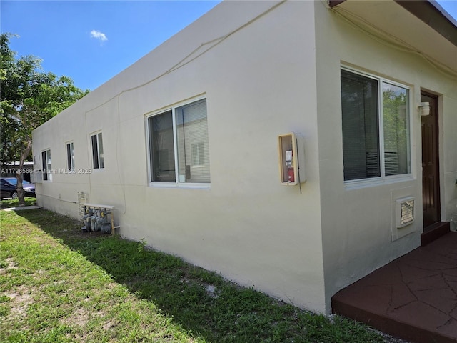 view of property exterior with stucco siding