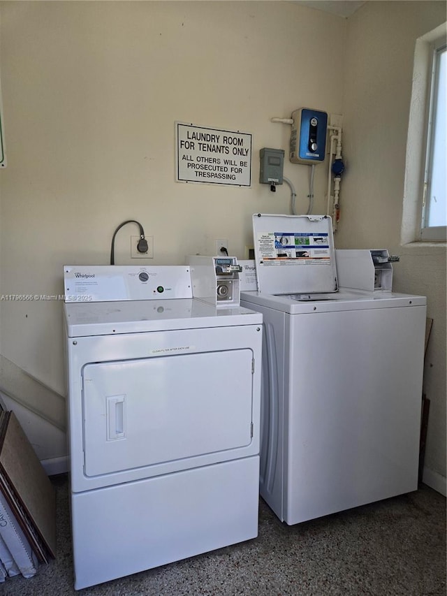 laundry area with washing machine and clothes dryer