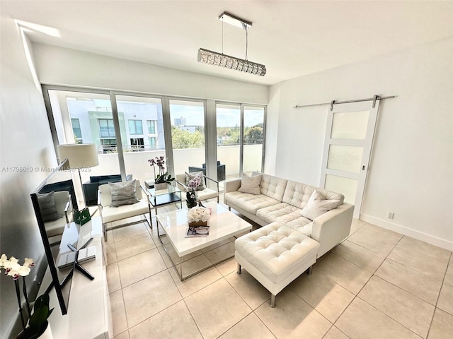 living area featuring light tile patterned flooring and baseboards
