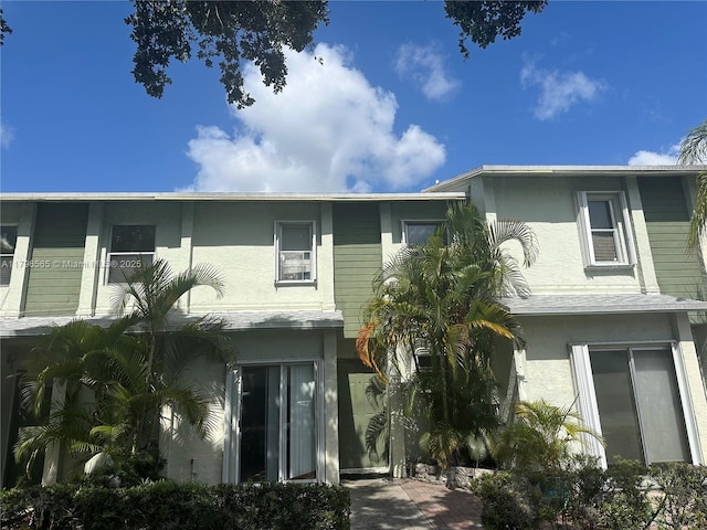 back of property with stucco siding