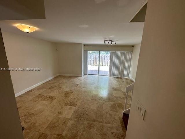 empty room with baseboards