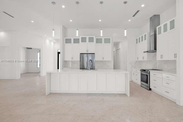 kitchen featuring stainless steel appliances, tasteful backsplash, and light countertops