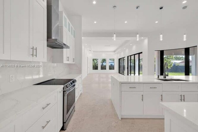empty room with a tray ceiling, visible vents, and recessed lighting