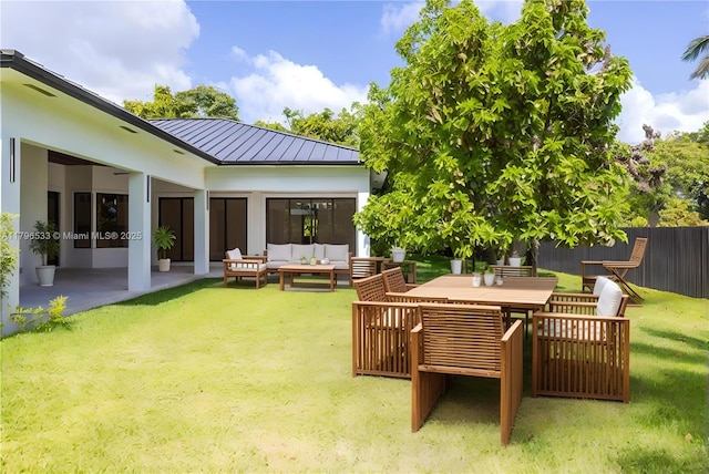 view of yard with a patio area, an outdoor living space, and fence