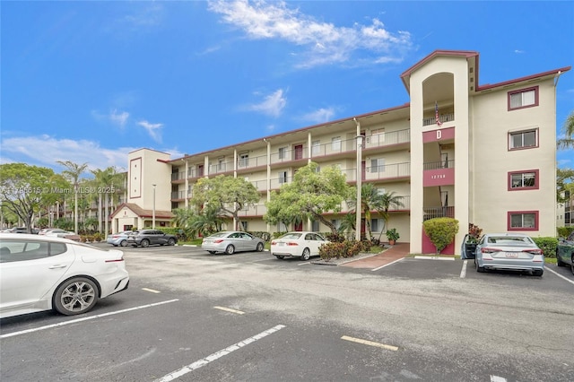 view of property with uncovered parking