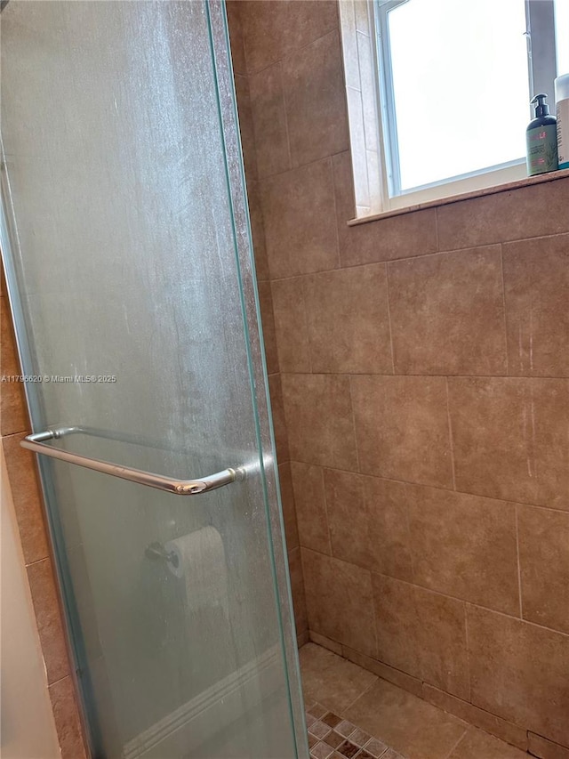 bathroom featuring a stall shower