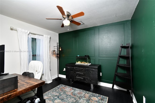 432 Piedmont St, Lehigh Acres, FL 33974 - office featuring dark wood-type flooring, baseboards, ceiling fan, and a decorative wall