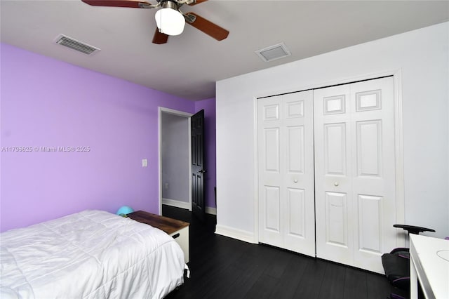 432 Piedmont St, Lehigh Acres, FL 33974 - bedroom featuring dark wood-type flooring, a closet, a ceiling fan, and baseboards