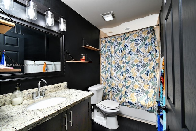 432 Piedmont St, Lehigh Acres, FL 33974 - bathroom with toilet, vanity, shower / bathtub combination with curtain, and wood finished floors