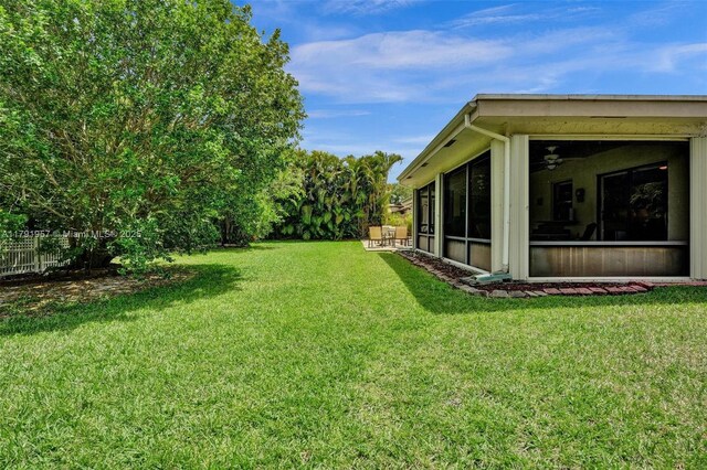 8215 NW 85th Ave, Tamarac, FL 33321 - view of yard with a sunroom and fence