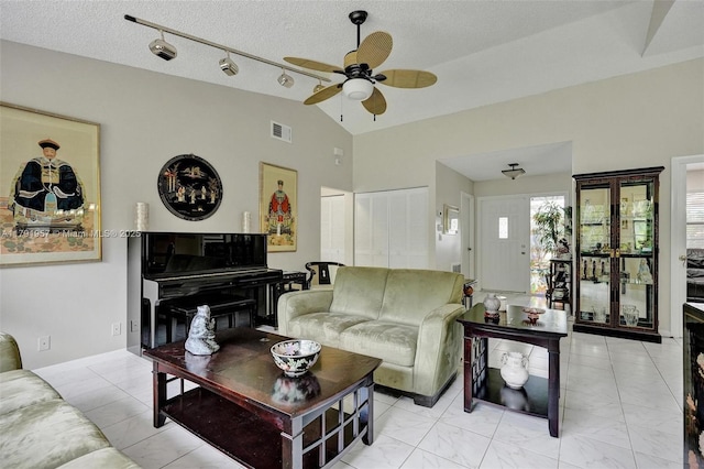8215 NW 85th Ave, Tamarac, FL 33321 - living area with a ceiling fan, visible vents, a textured ceiling, and vaulted ceiling