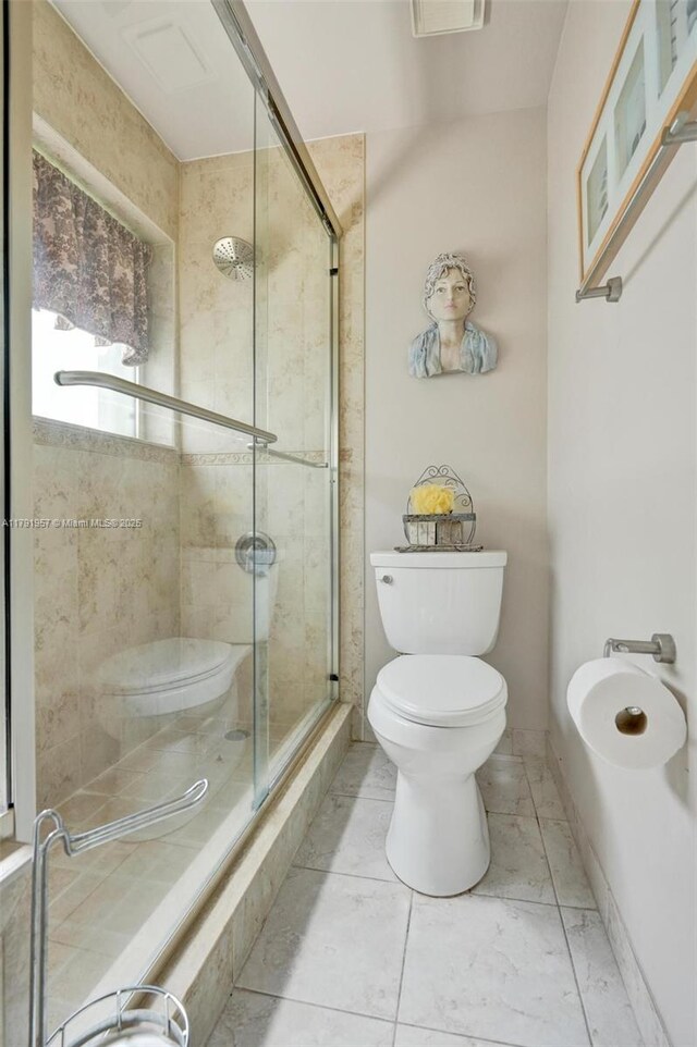 8215 NW 85th Ave, Tamarac, FL 33321 - bathroom with a stall shower, toilet, and baseboards