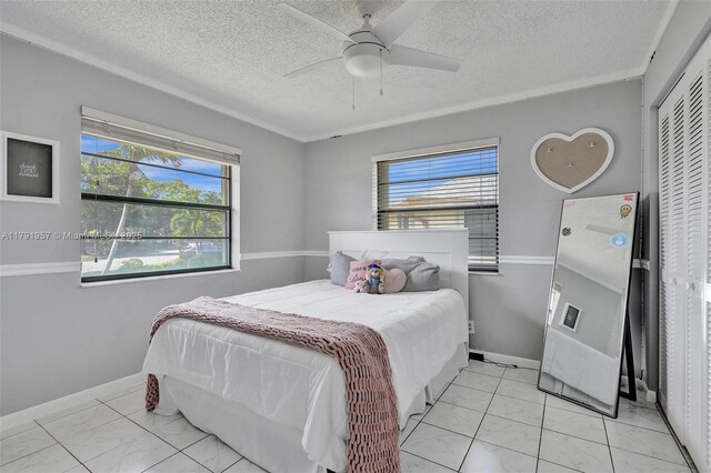 8215 NW 85th Ave, Tamarac, FL 33321 - bedroom with marble finish floor, a closet, and multiple windows