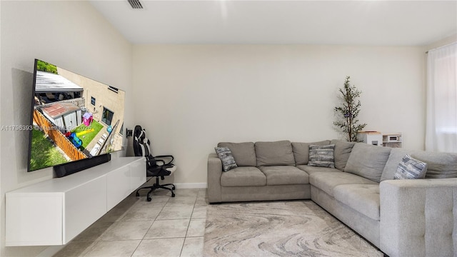 living room with visible vents and light tile patterned flooring