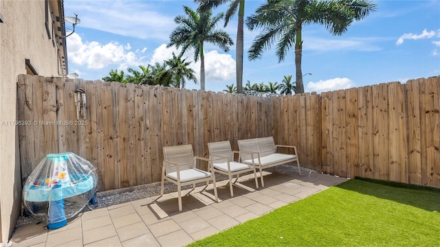 view of patio featuring fence