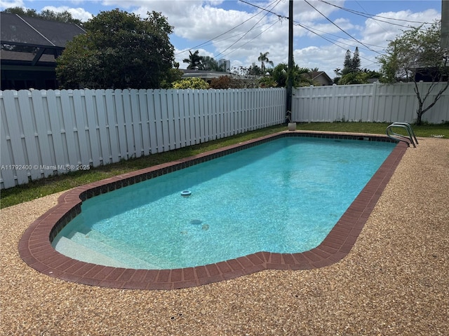 view of swimming pool with a fenced in pool and a fenced backyard