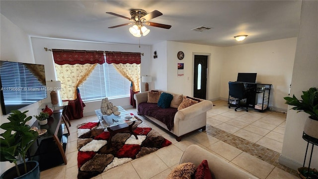 living room featuring ceiling fan, light tile patterned flooring, and visible vents