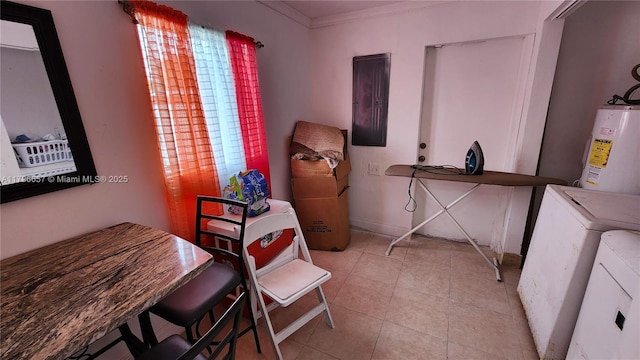interior space featuring baseboards, crown molding, electric panel, washer and clothes dryer, and water heater