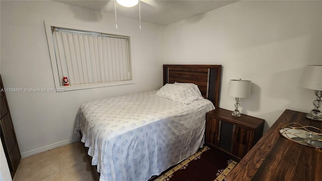 bedroom featuring ceiling fan and baseboards