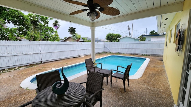 view of pool with a fenced backyard, ceiling fan, a patio area, and a fenced in pool
