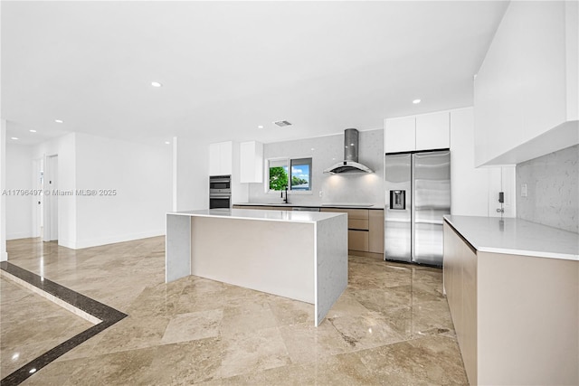 5510 NE 18th Ave, Fort Lauderdale, FL 33334 - kitchen featuring a sink, stainless steel appliances, wall chimney range hood, white cabinets, and modern cabinets