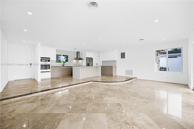 5510 NE 18th Ave, Fort Lauderdale, FL 33334 - unfurnished living room with marble finish floor, recessed lighting, and visible vents
