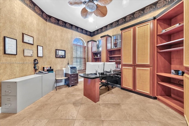home office featuring light tile patterned floors and a ceiling fan