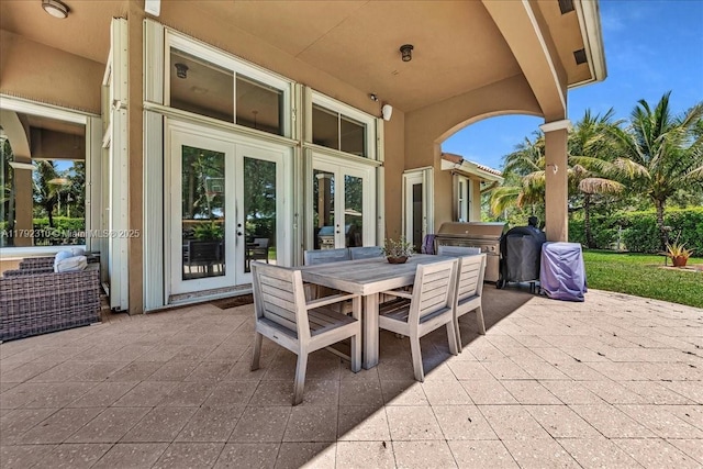 view of patio / terrace featuring outdoor dining area and french doors