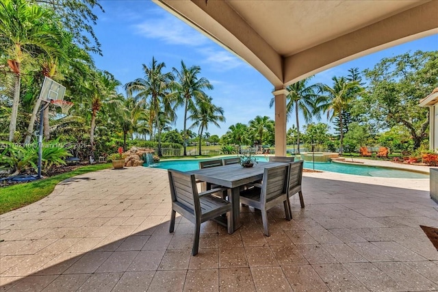 view of patio / terrace with a pool with connected hot tub