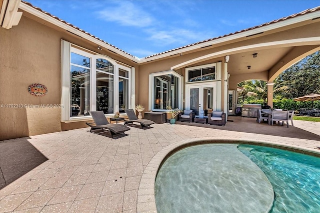exterior space with a patio and french doors