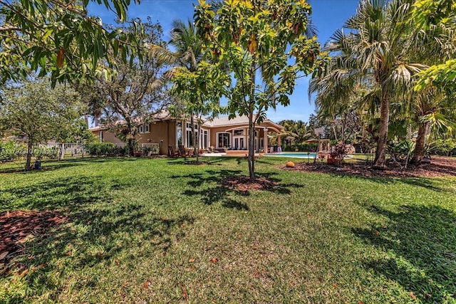 view of yard featuring an outdoor pool