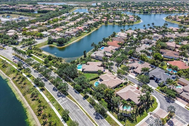 aerial view with a water view and a residential view