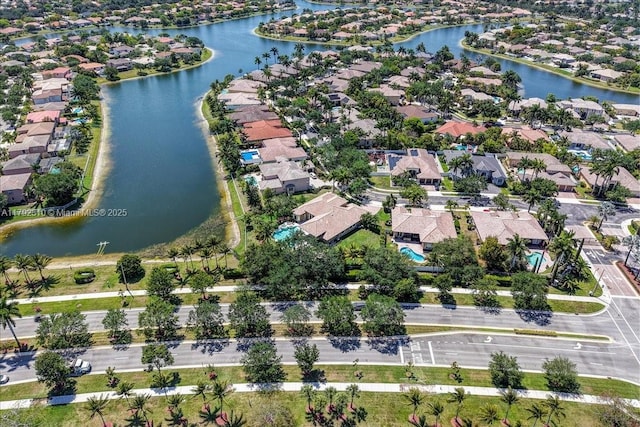 bird's eye view with a water view and a residential view
