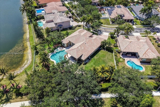 birds eye view of property with a residential view