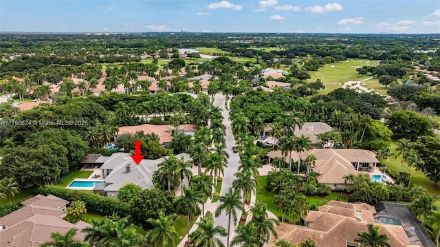 birds eye view of property with a residential view
