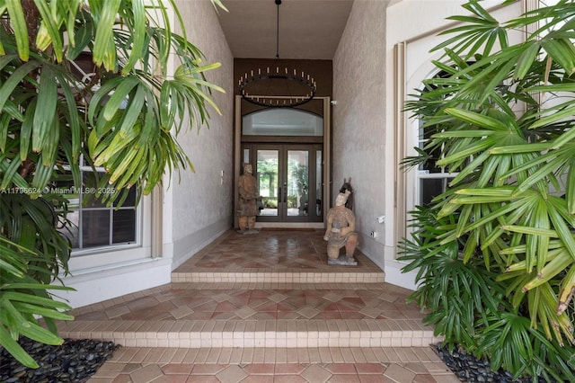 doorway to property with stucco siding and french doors