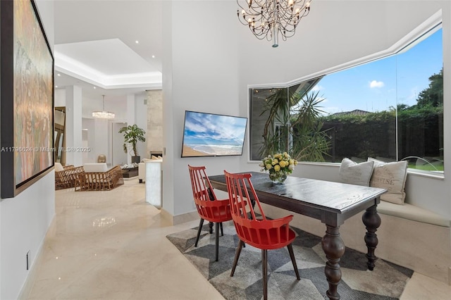 dining space with a chandelier and baseboards
