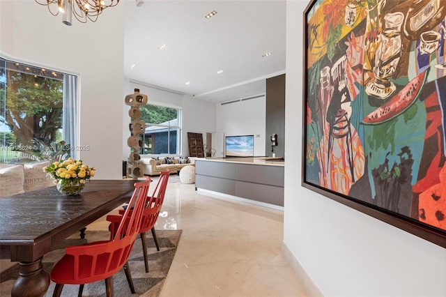dining space with a notable chandelier
