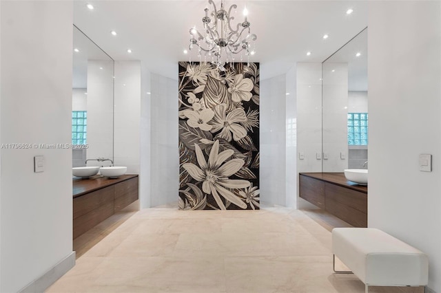 bathroom with a chandelier, recessed lighting, and vanity