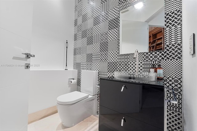 bathroom featuring toilet and vanity
