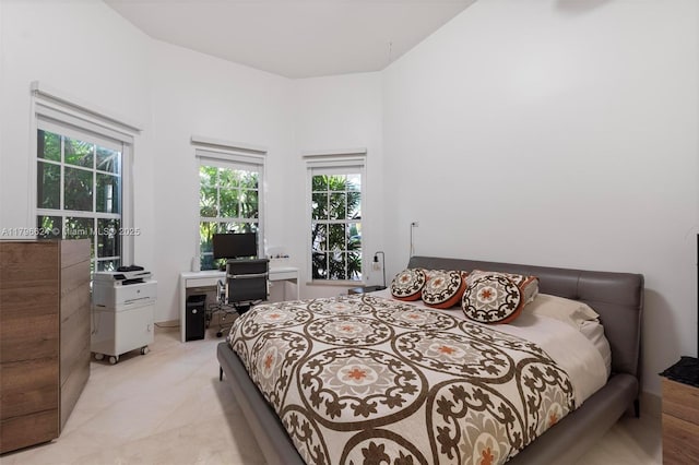 bedroom with multiple windows