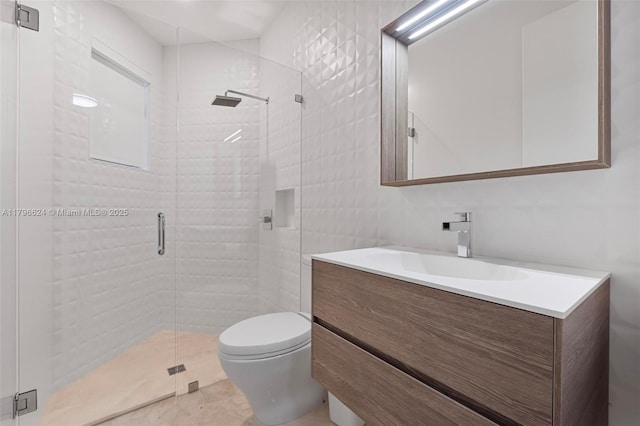 bathroom featuring a stall shower, vanity, and toilet