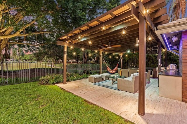 view of patio / terrace with an outdoor living space, ceiling fan, and a fenced backyard