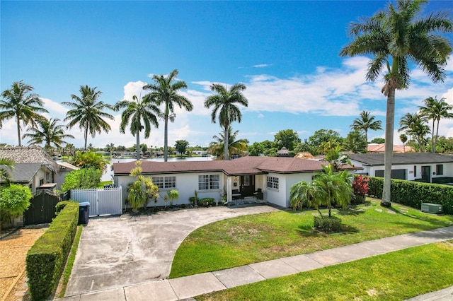 17931 NW 85th Ave, Hialeah, FL 33015 - single story home with a gate, driveway, stucco siding, and a residential view