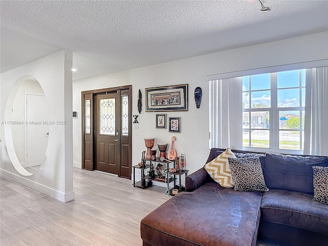 17931 NW 85th Ave, Hialeah, FL 33015 - living room featuring light wood finished floors and a textured ceiling