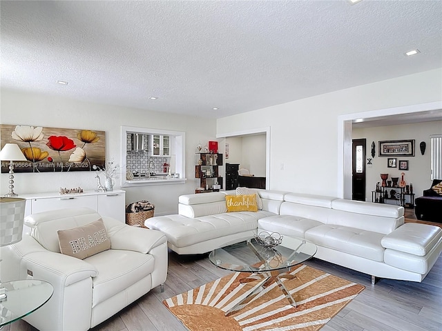 17931 NW 85th Ave, Hialeah, FL 33015 - living area featuring wood finished floors and a textured ceiling